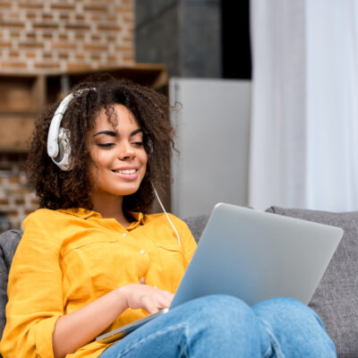 Featured Image For Office Music Playlist: Encouraging Songs to Inspire Your Team Team Building Post